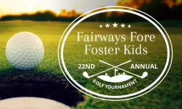 close up of a golf ball about to go in the hole with a setting sun, advertising the Fairways Fore Foster Kids 22nd Annual Golf Tournament